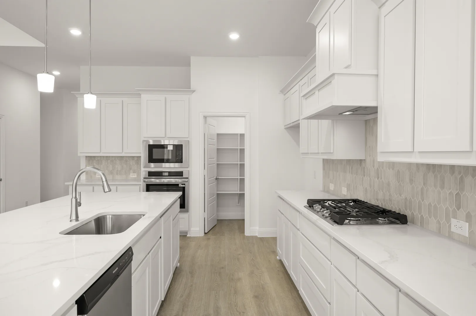Kitchen with stainless-steel appliances in available home at Westside Preserve by Kindred Homes in Midlothian