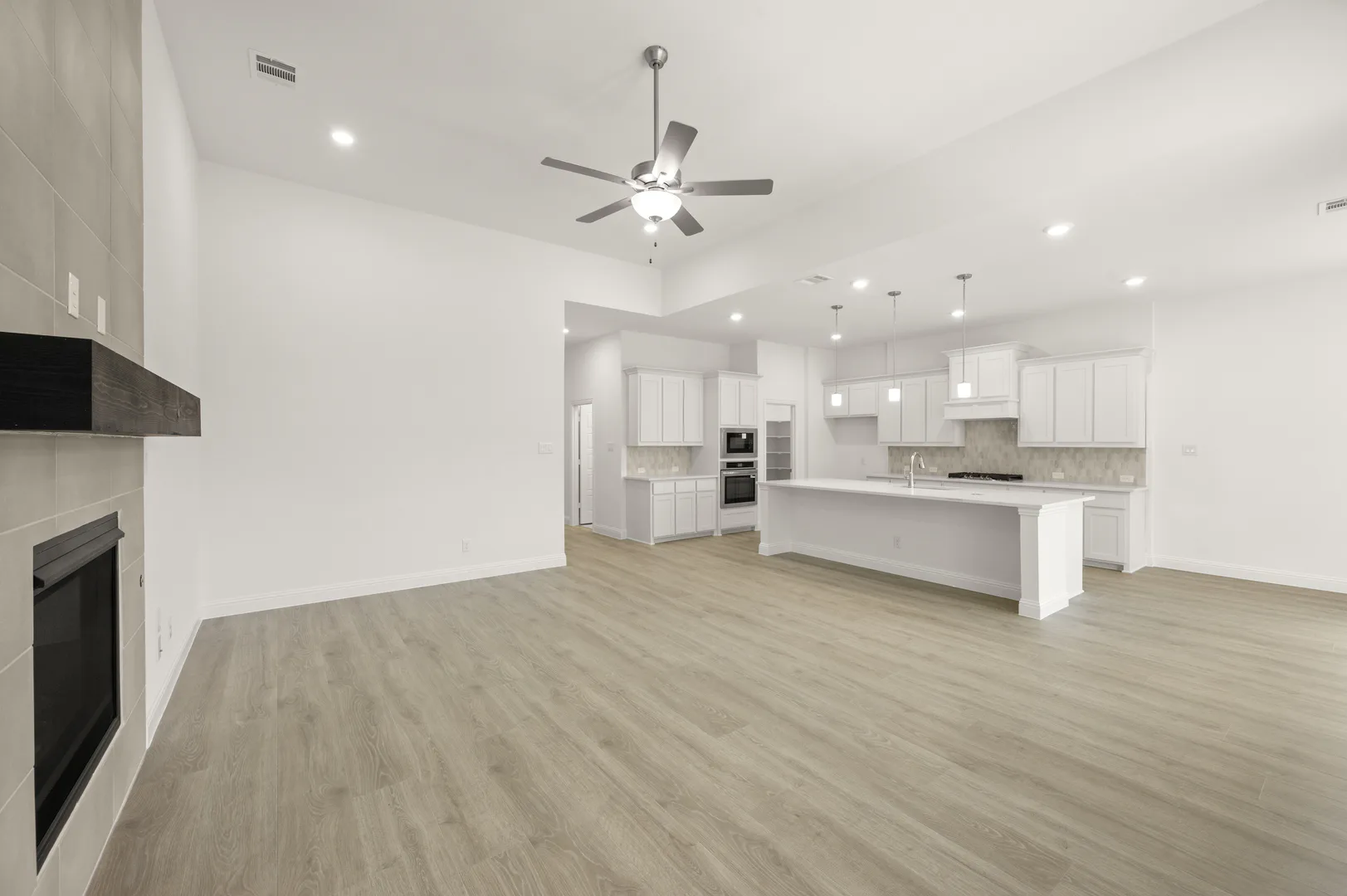 Living room and kitchen in available home at Westside Preserve by Kindred Homes in Midlothian