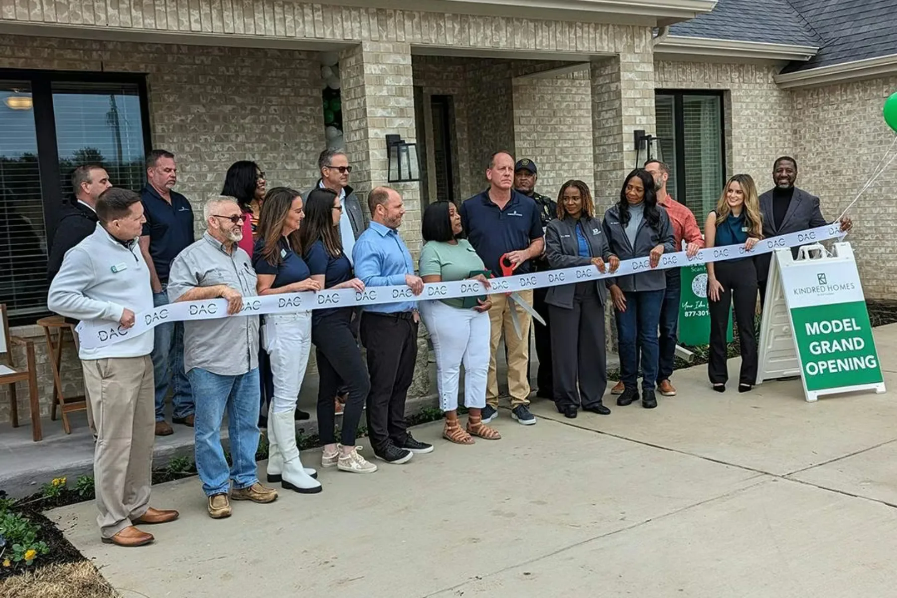 Kindred Homes ribbon cutting group photo