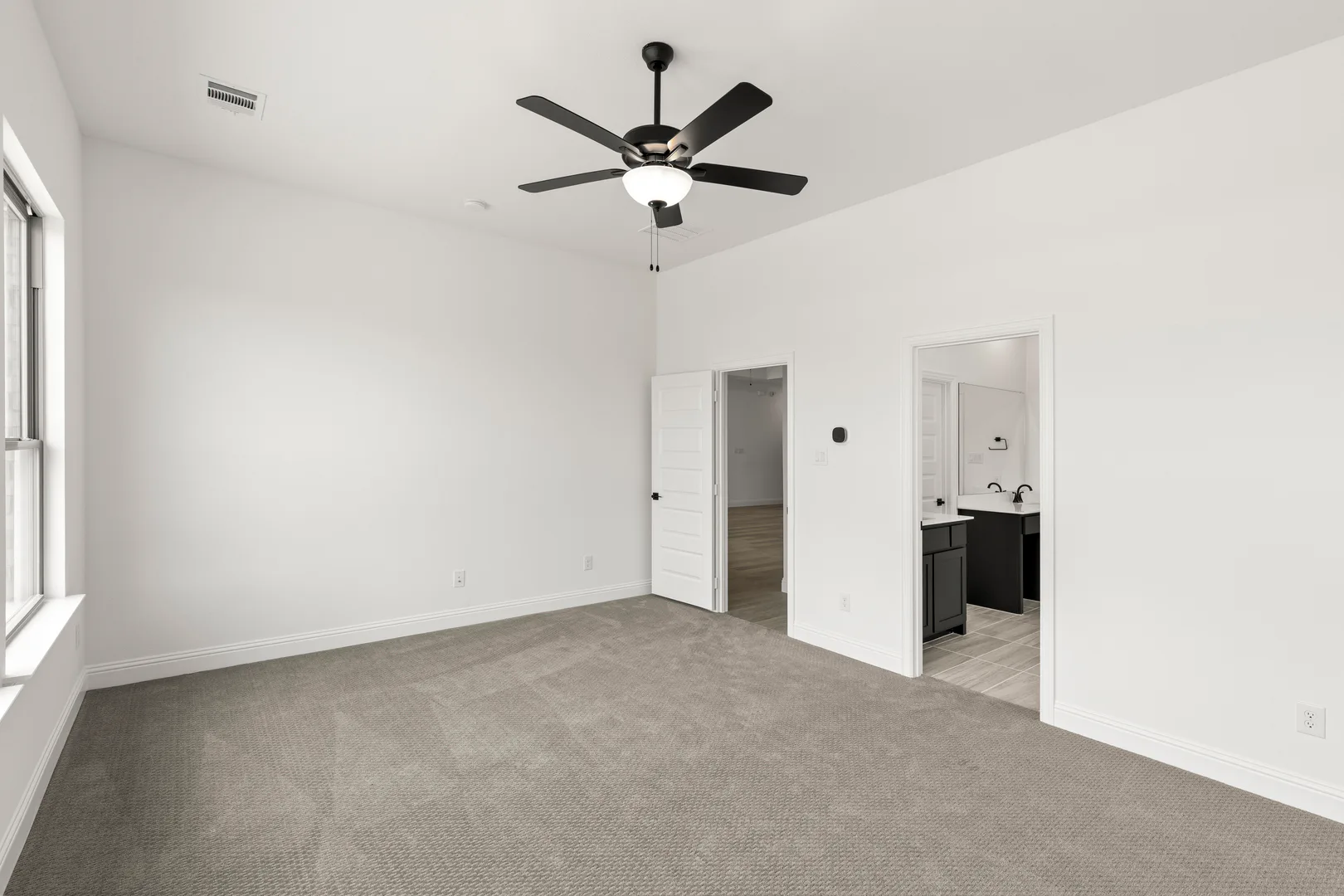 Primary bedroom in available home at Park Trails by Kindred Homes in Forney