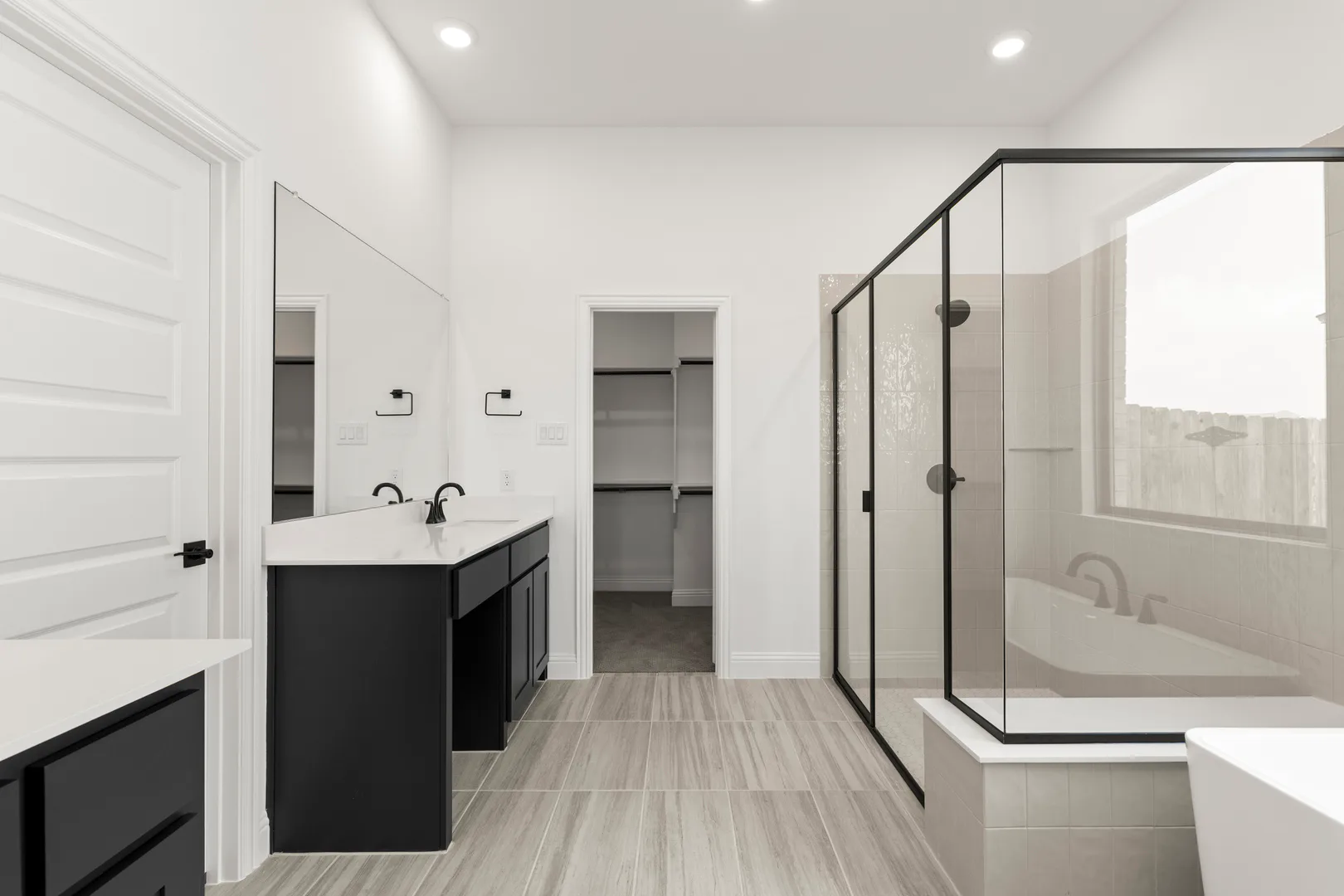 Primary bathroom in available home at Park Trails by Kindred Homes in Forney