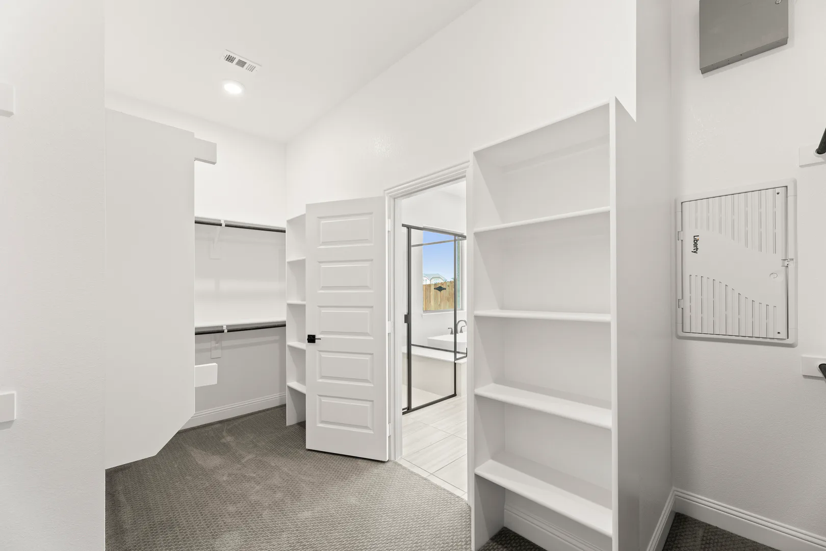 Spacious primary closet in available home at Park Trails by Kindred Homes in Forney