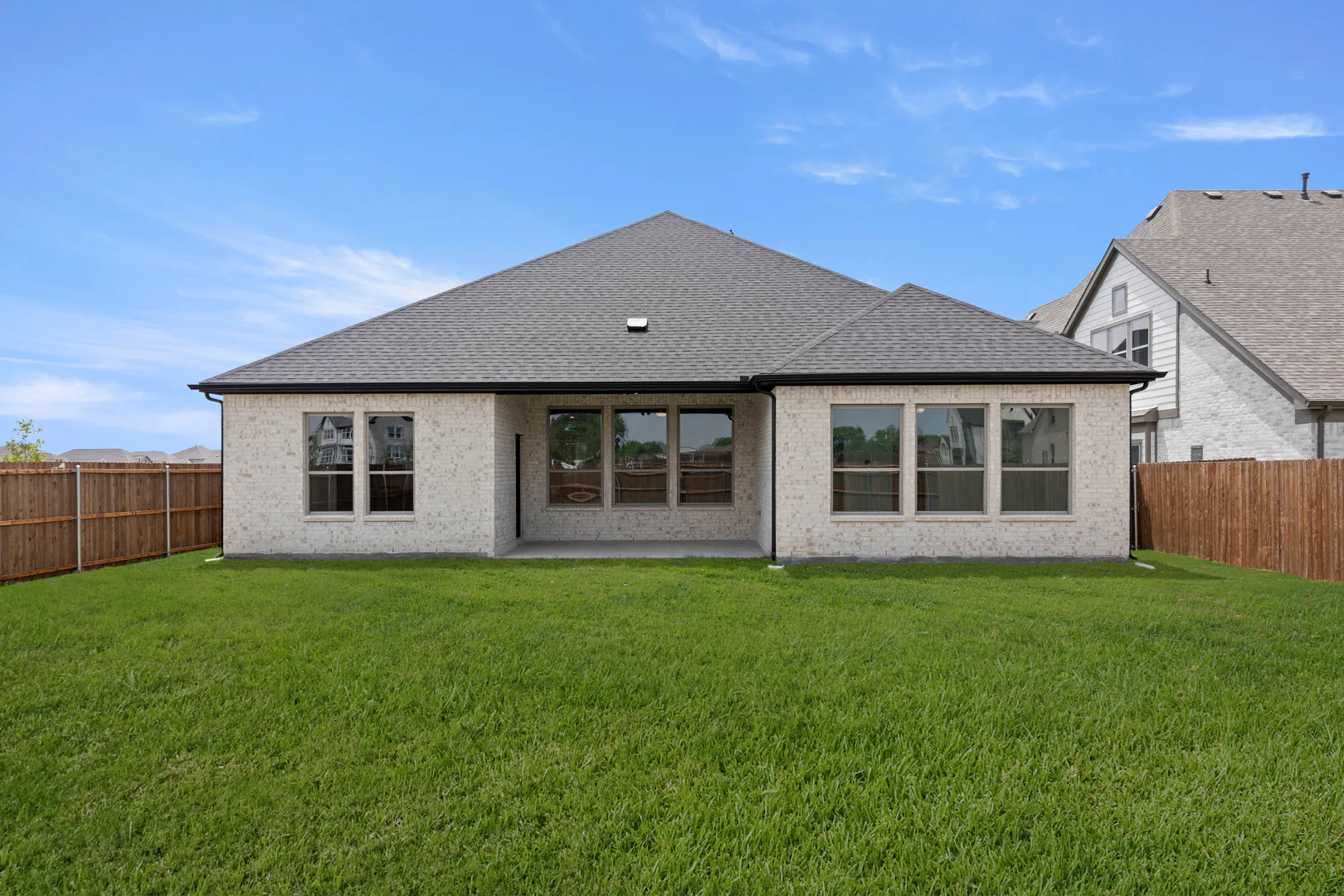 Back exterior in available home at Park Trails by Kindred Homes in Forney