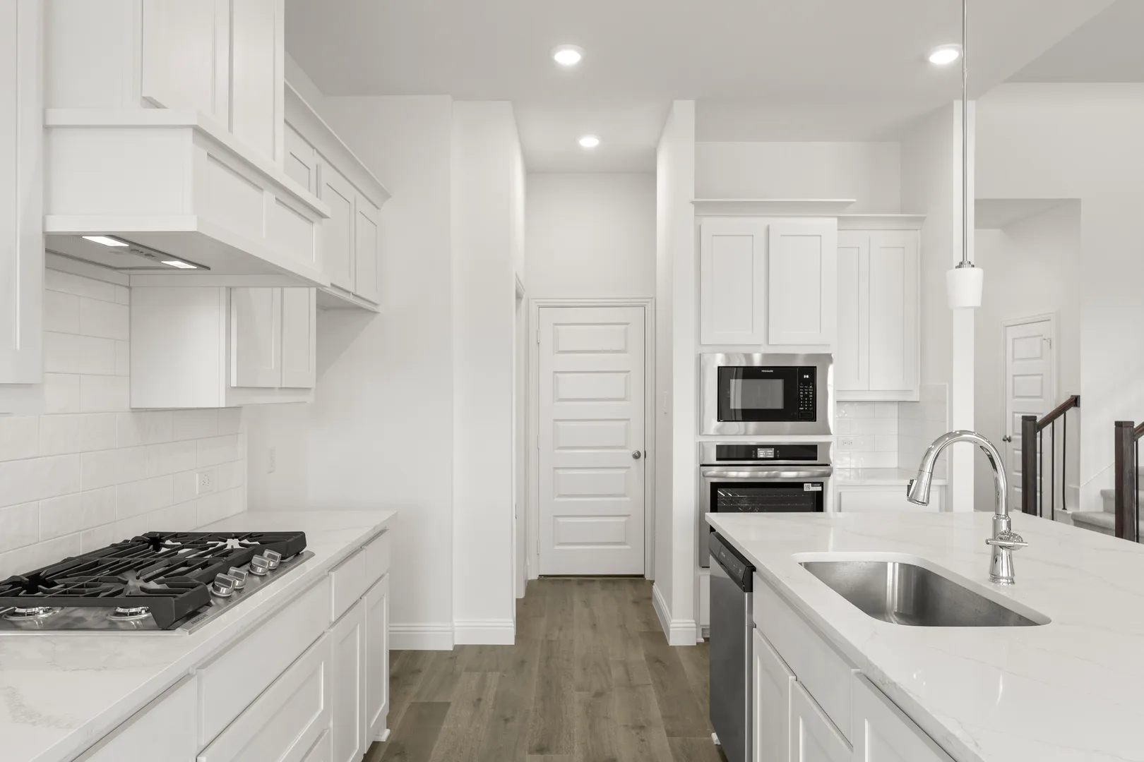Kitchen and kitchen appliances in a new home available at Park Trails by Kindred Homes in Forney