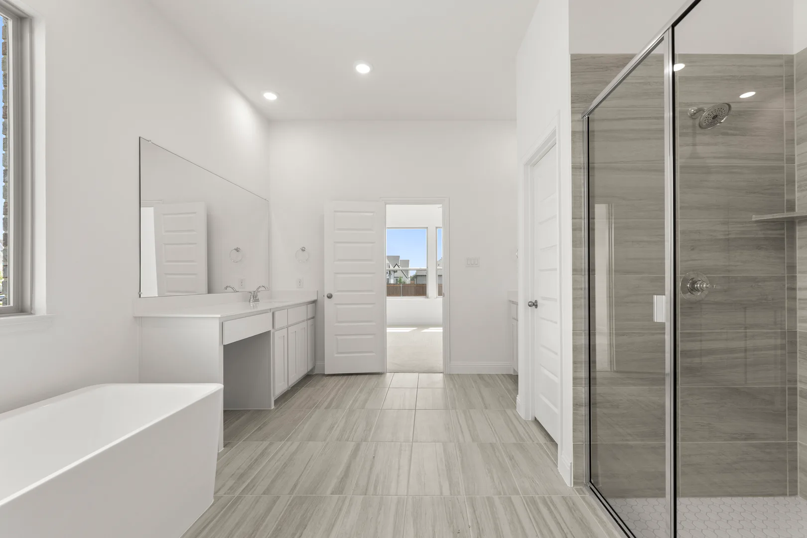 Primary bathroom in a new home available at Park Trails by Kindred Homes in Forney