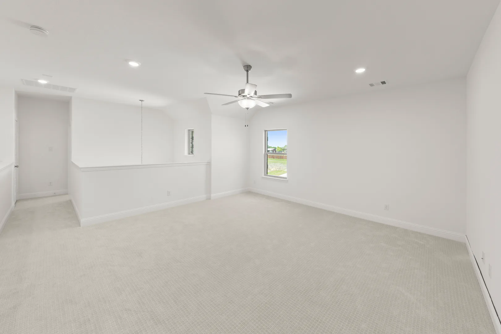 Spacious game room in a new home available at Park Trails by Kindred Homes in Forney