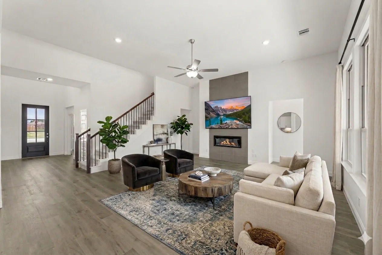 Virtually staged living room of a new home available at Park Trails by Kindred Homes in Forney