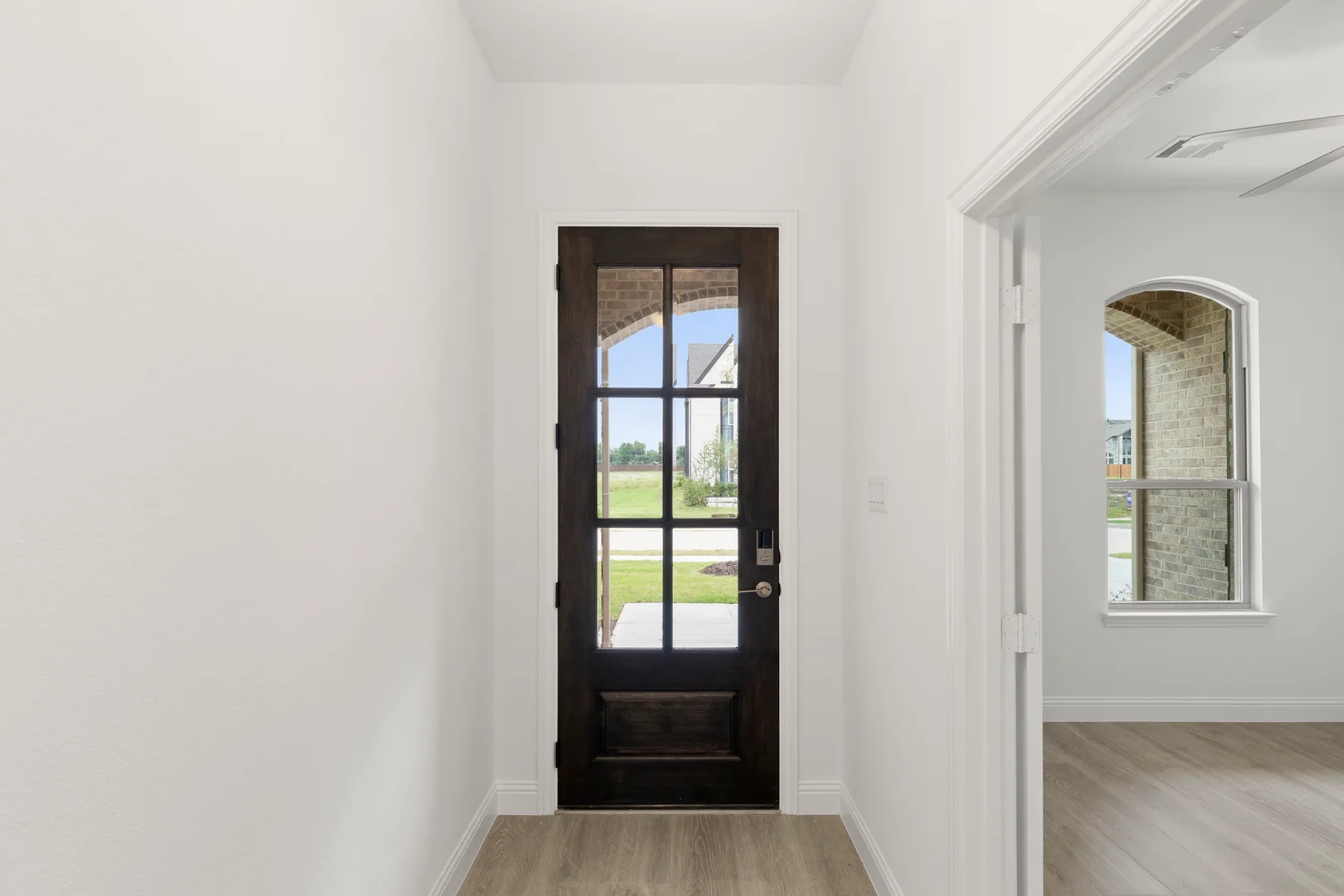 Entryway of a modern tudor style home by Kindred Homes