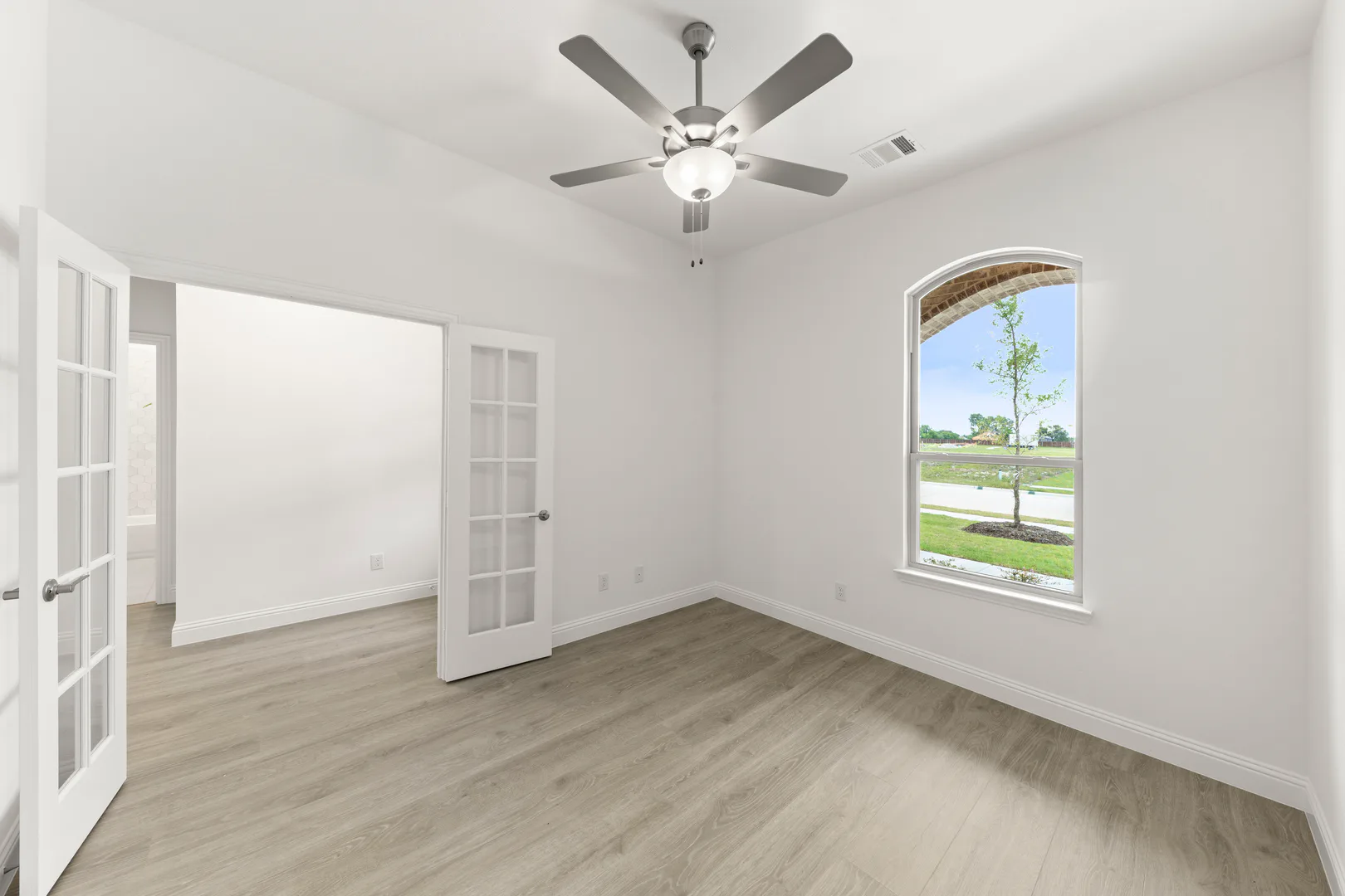Study in a modern tudor style home by Kindred Homes