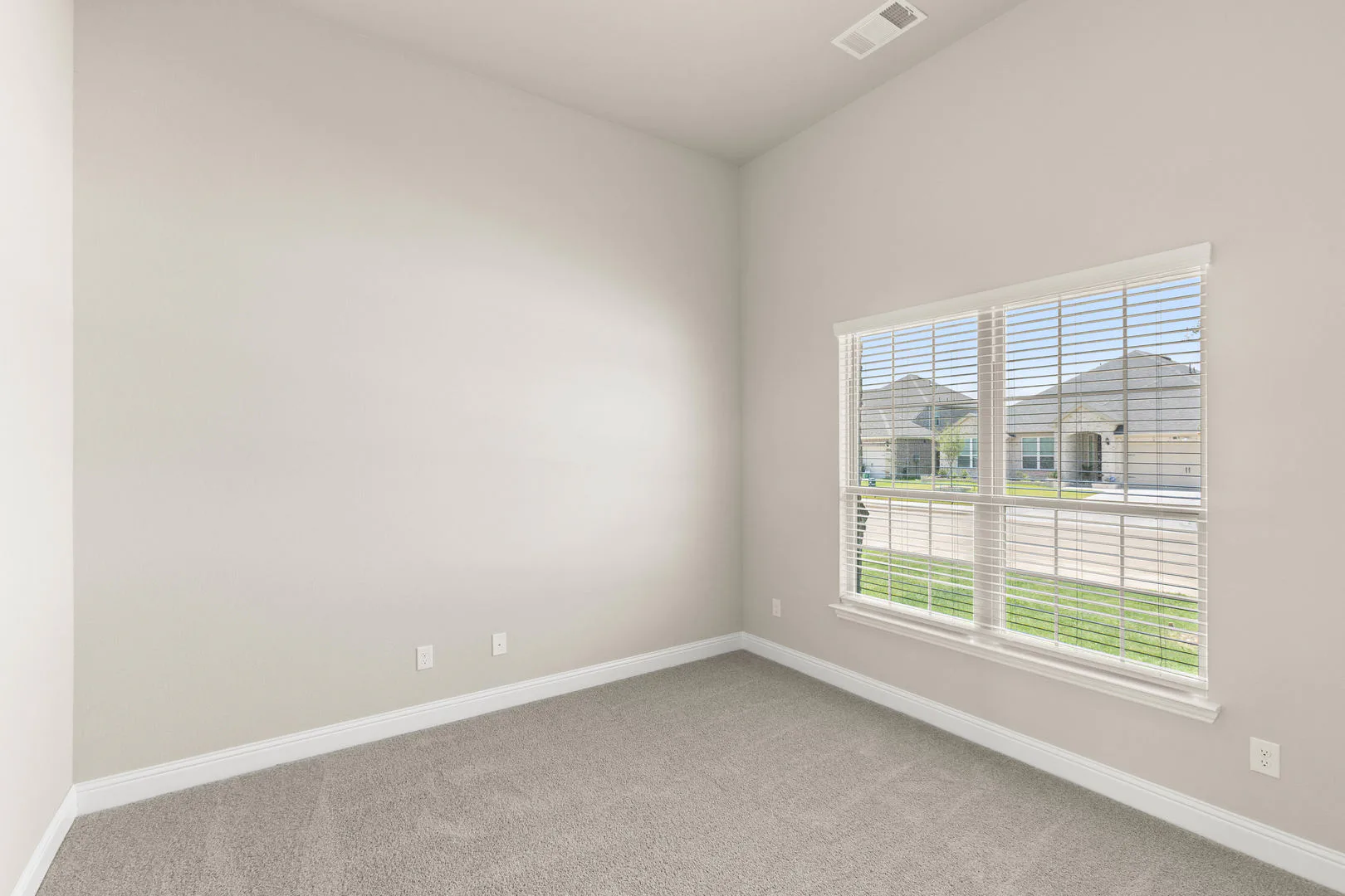 Secondary bedroom in a new traditional style home by Kindred Homes