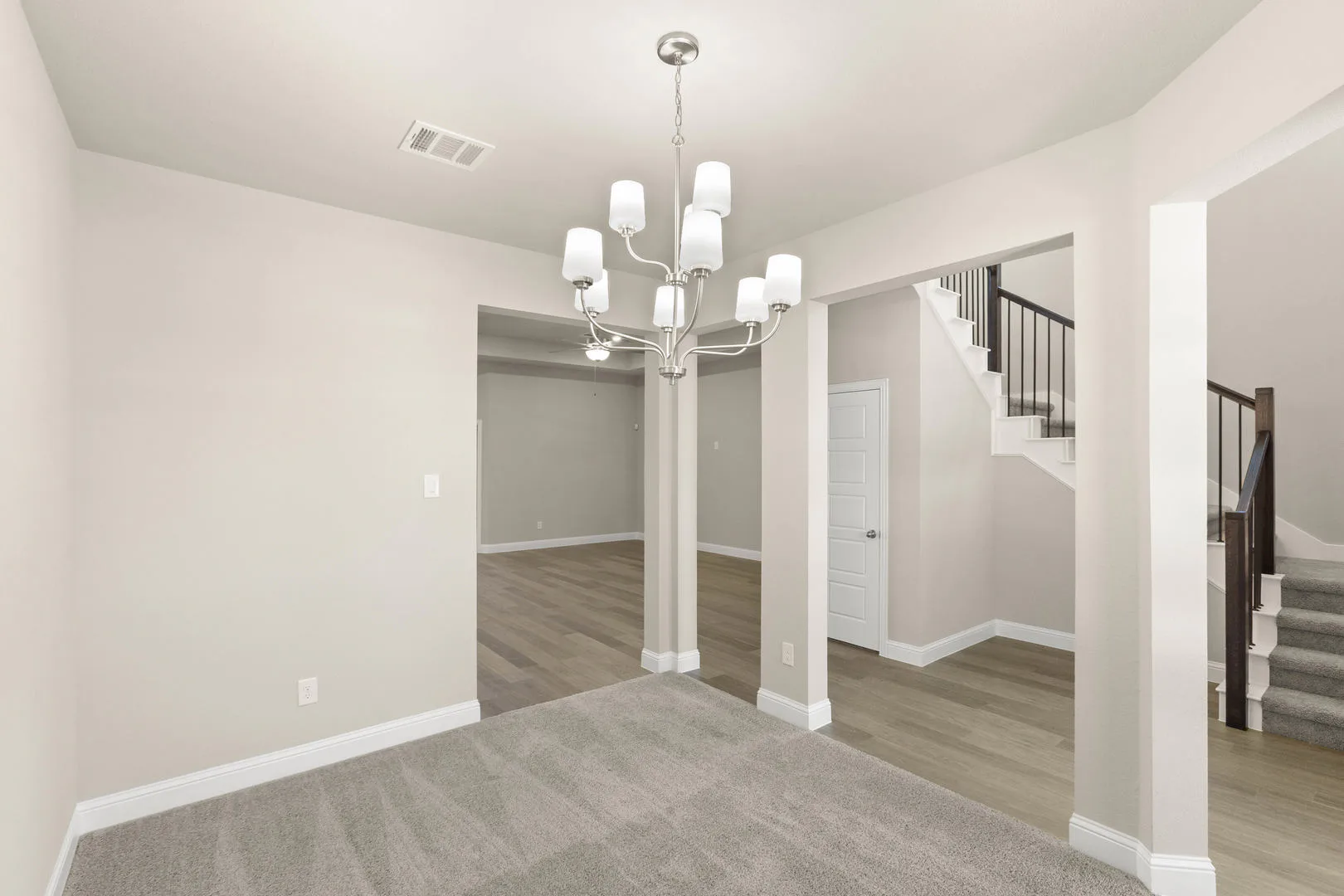 Dining room in a new traditional style home by Kindred Homes