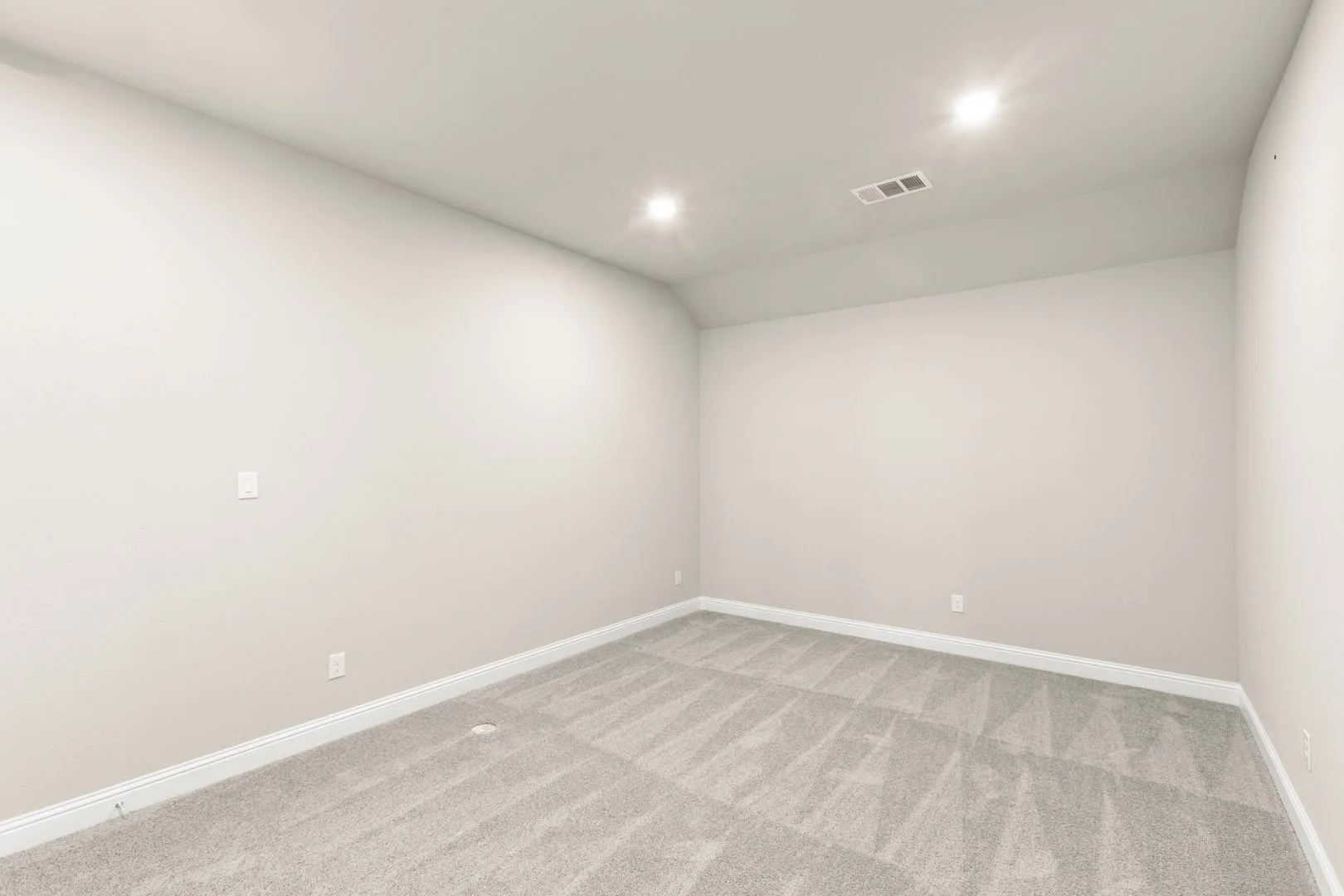 Media room in a new traditional style home by Kindred Homes