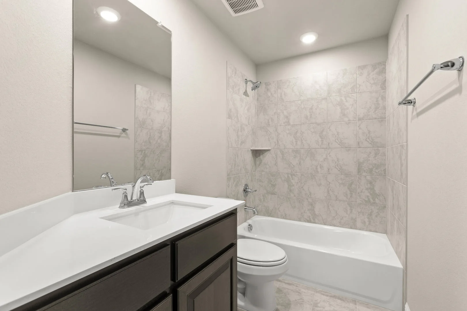 Secondary bathroom in a new traditional style home by Kindred Homes