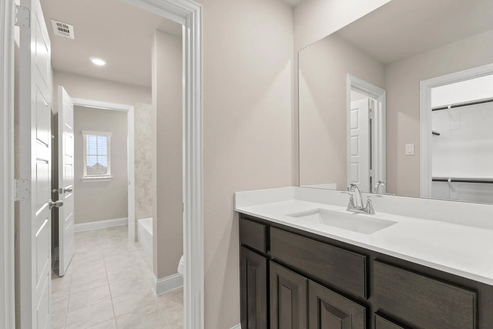 Secondary bathroom in a new traditional style home by Kindred Homes