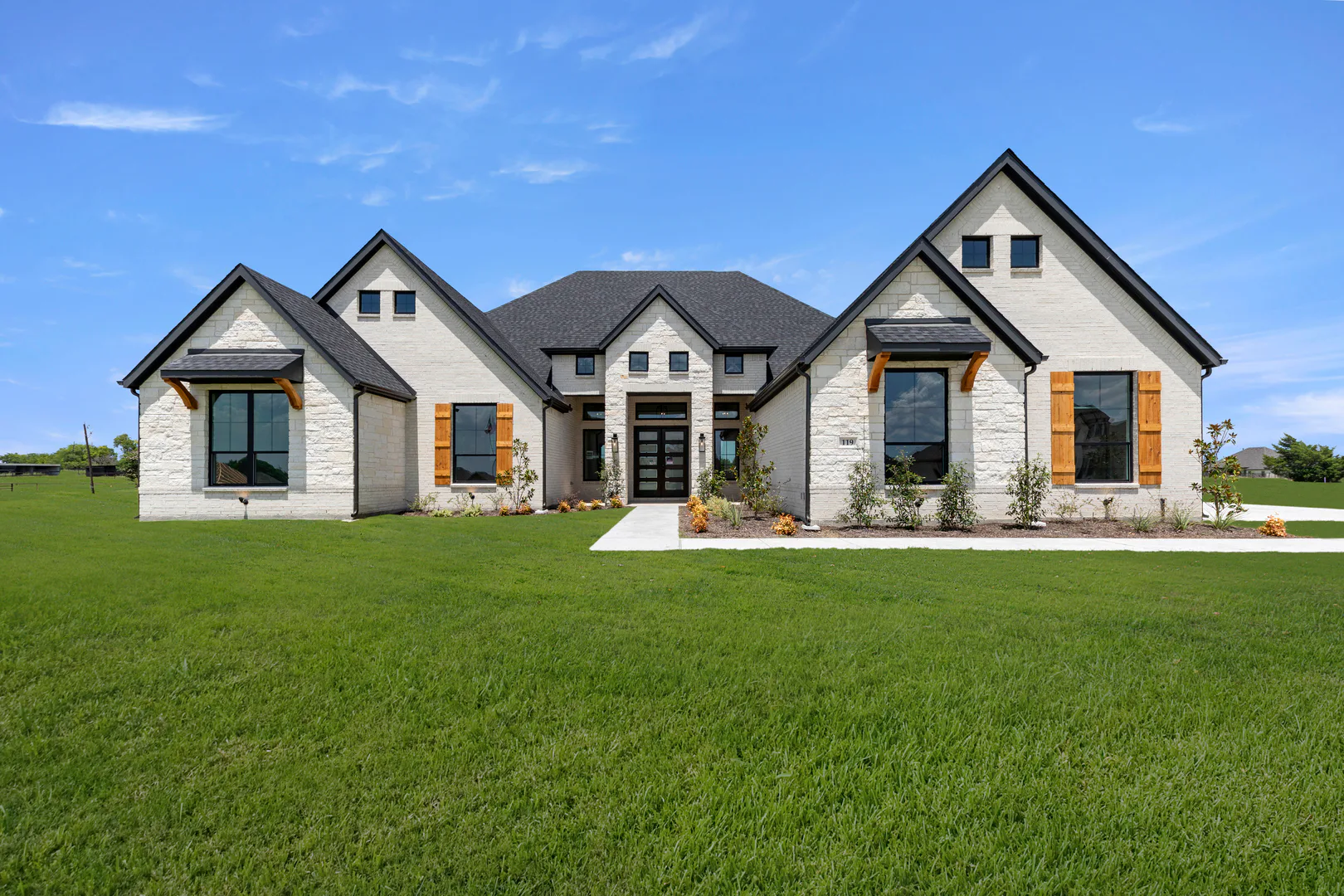 Exterior of a transitional ranch style home by Kindred Homes