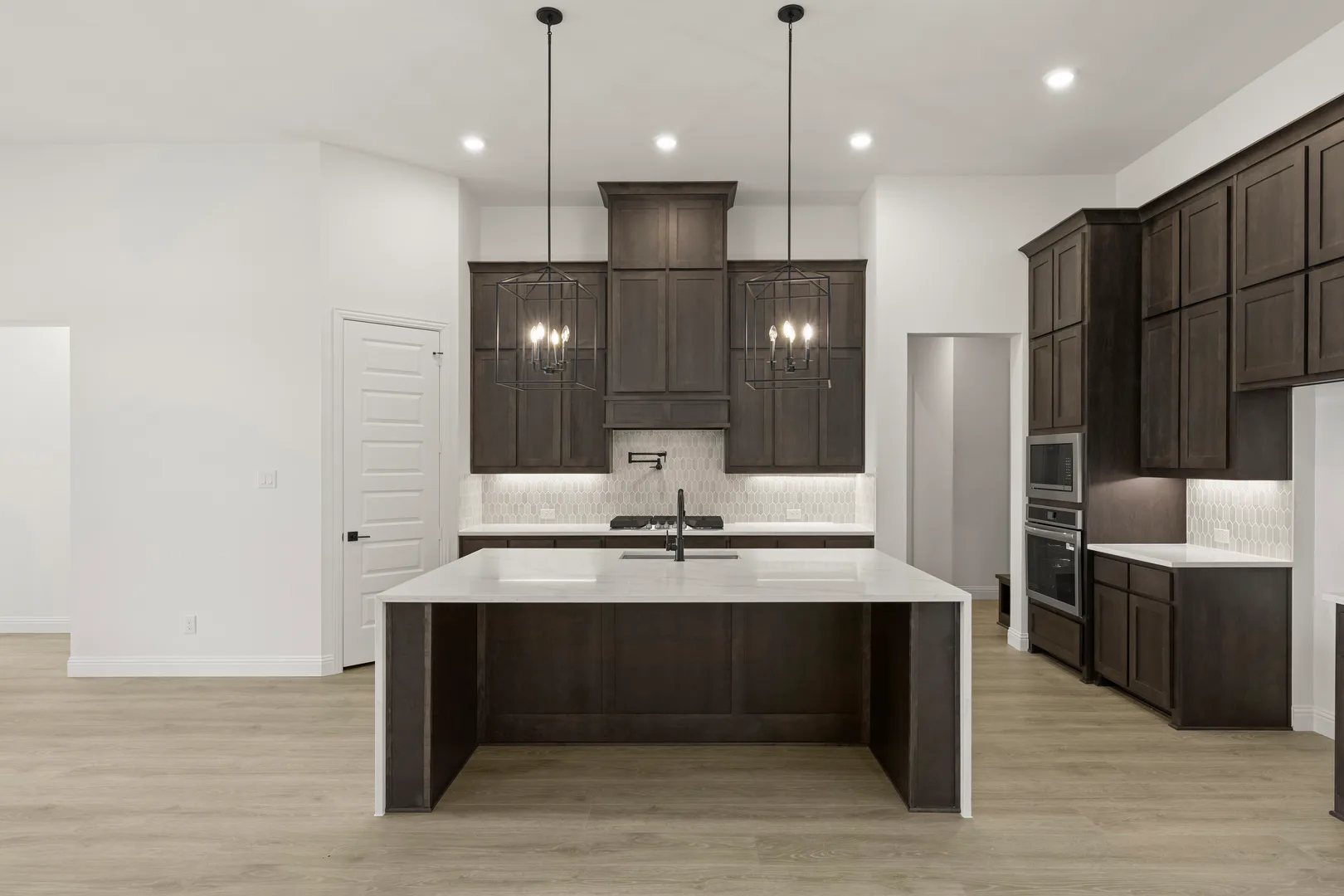 Kitchen in a transitional ranch style home by Kindred Homes