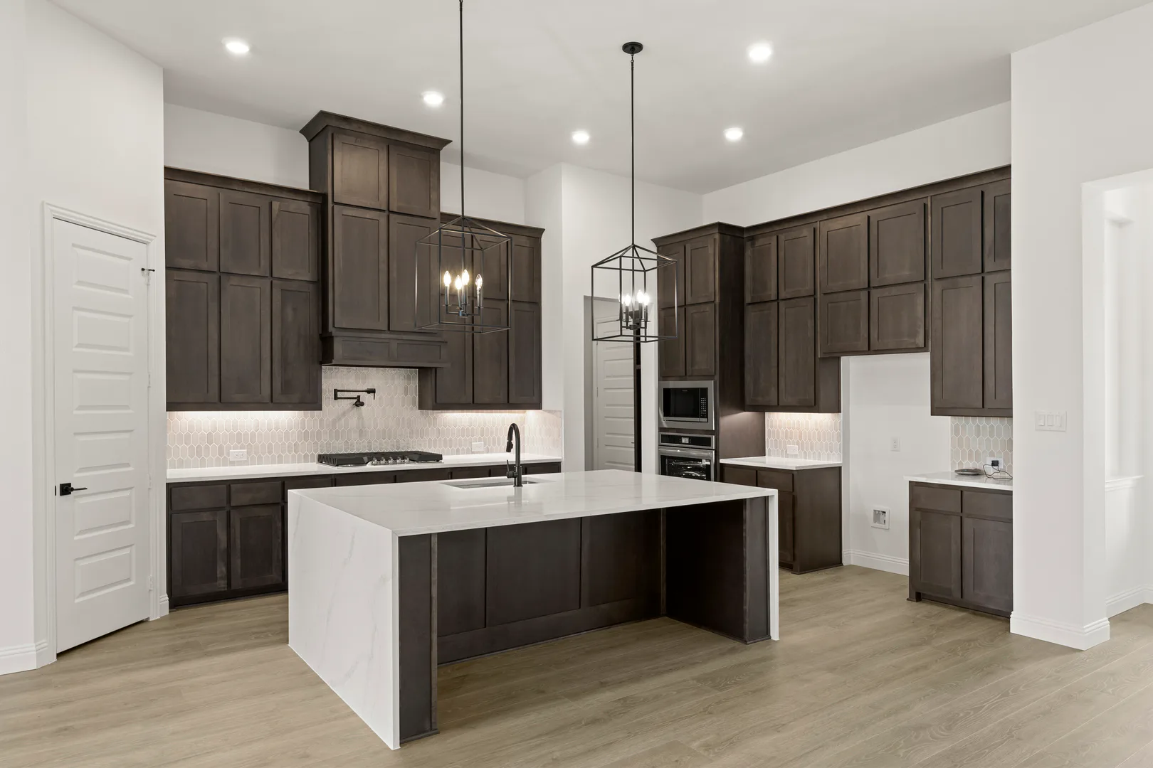 Kitchen in a transitional ranch style home by Kindred Homes
