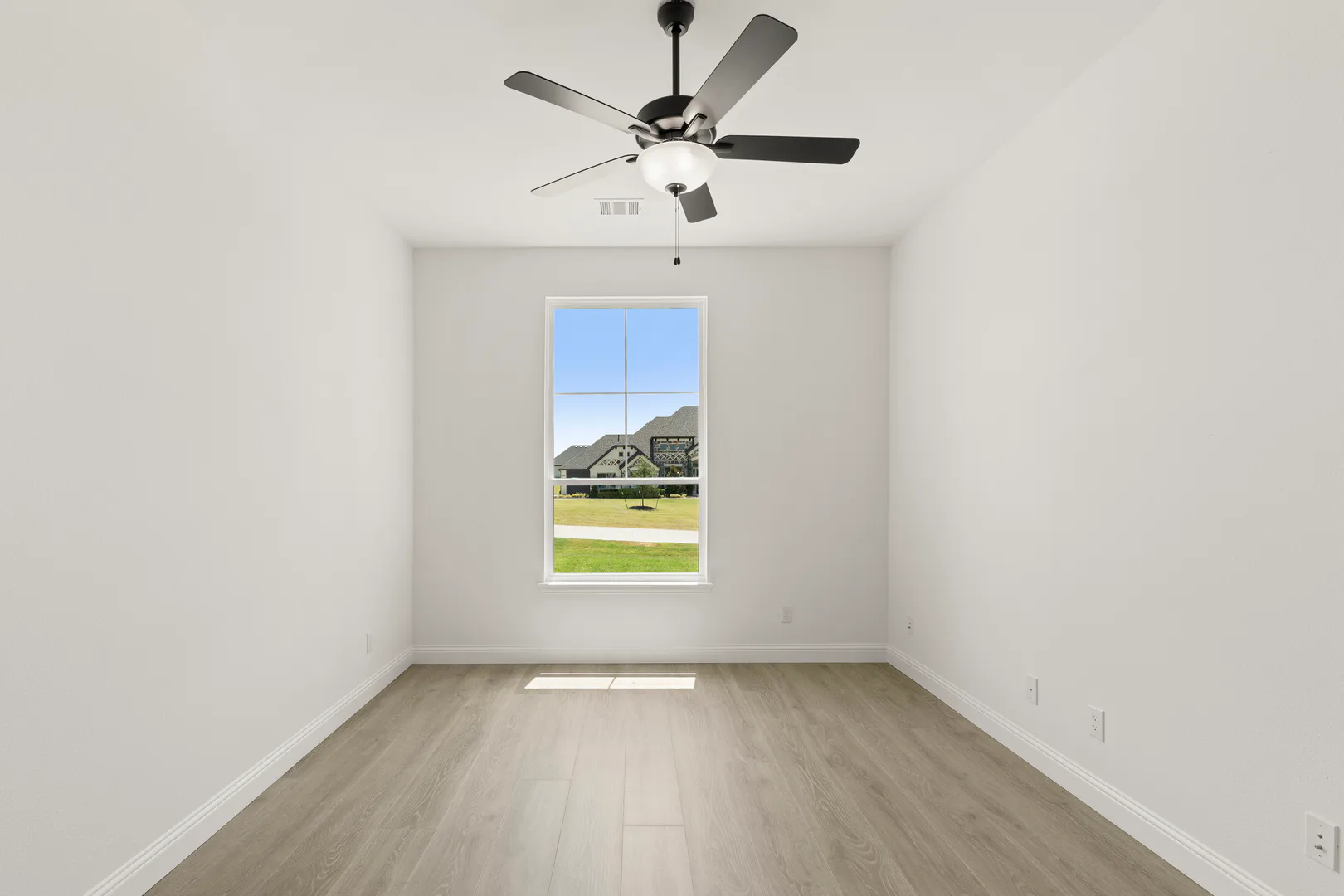 Study in a transitional ranch style home by Kindred Homes