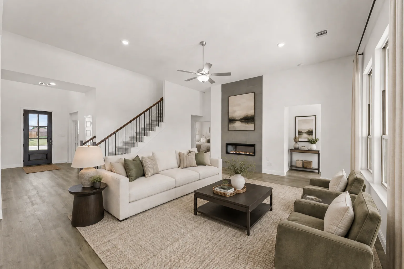 Virtually staged living room in a modern farmhouse transitional home by Kindred Homes