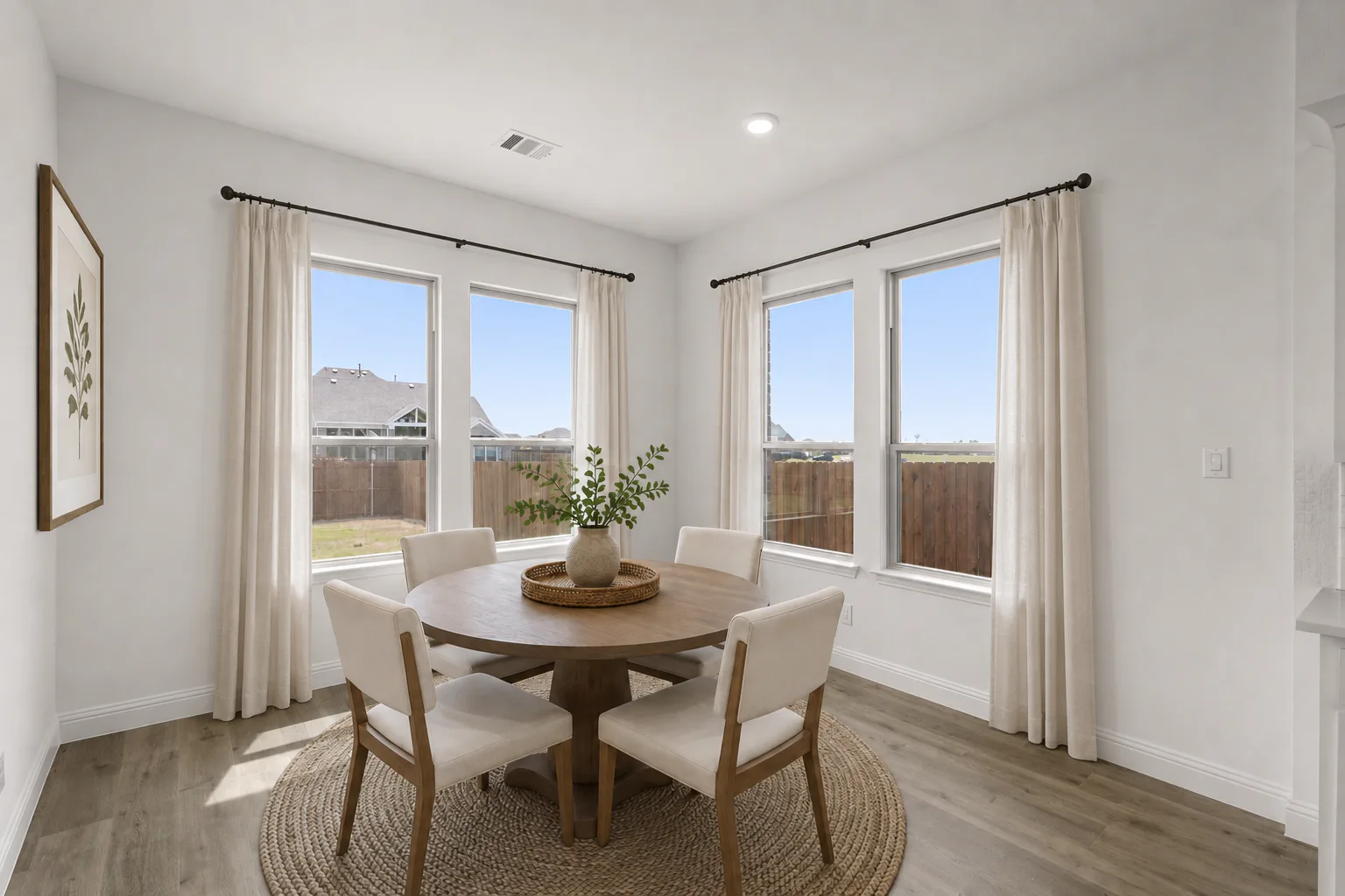 Virtually staged breakfast nook in a modern farmhouse transitional home by Kindred Homes
