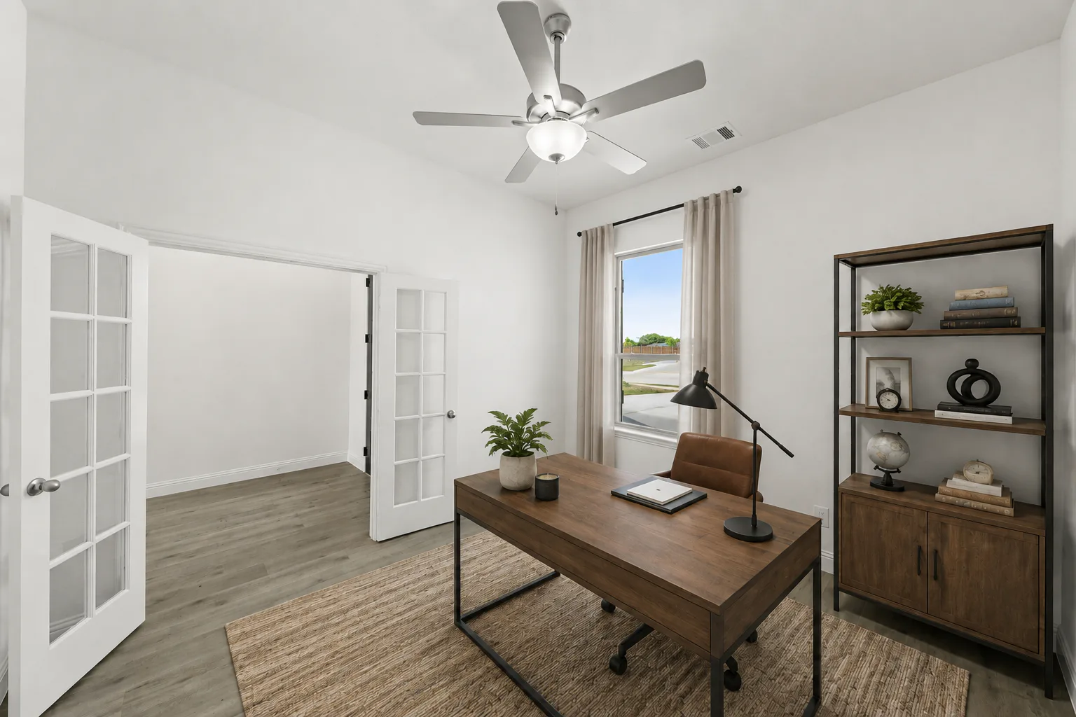 Virtually staged study in a modern farmhouse transitional home by Kindred Homes