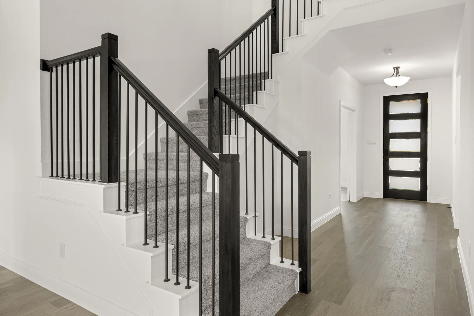 Entryway of a new traditional style home by Kindred Homes
