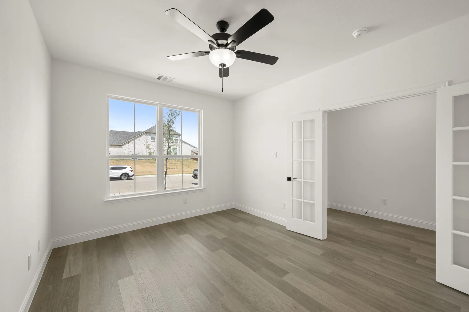 Study in a new traditional style home by Kindred Homes