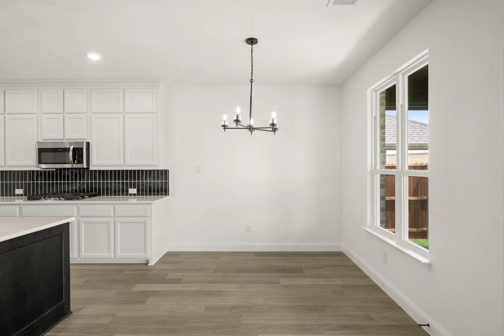 Breakfast nook in a new traditional style home by Kindred Homes