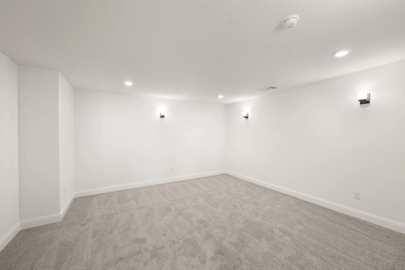 Media room in a new traditional style home by Kindred Homes