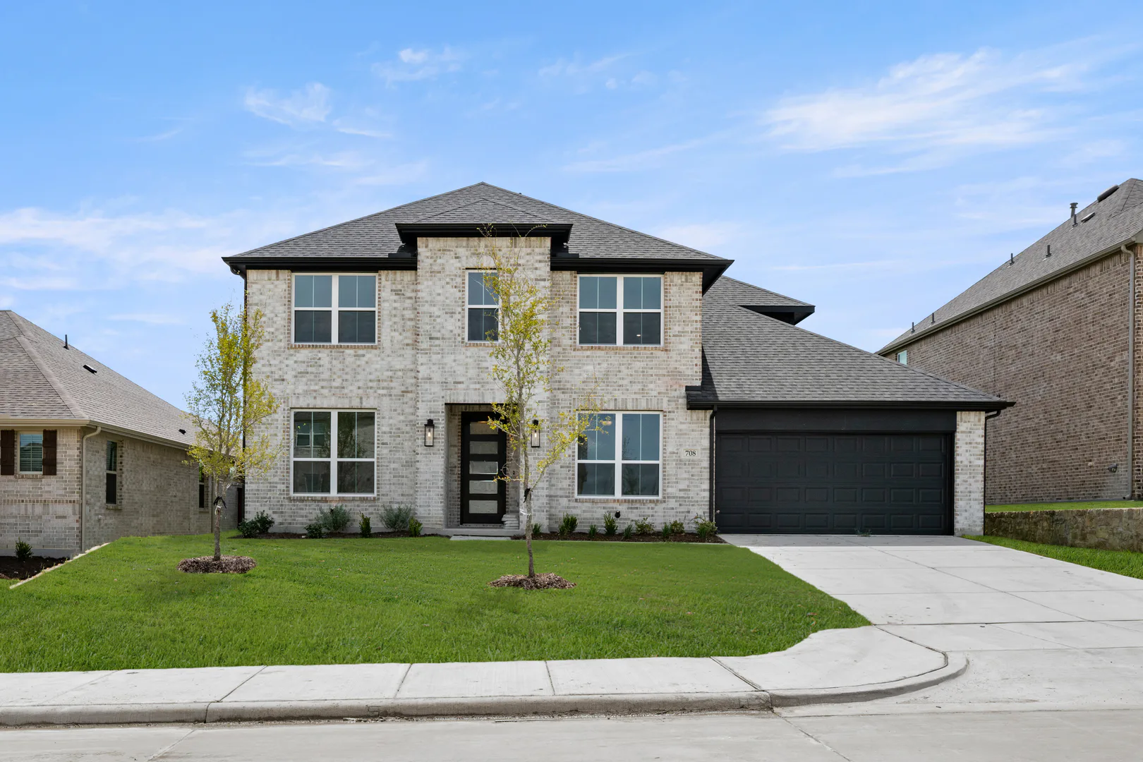 Exterior of a new traditional style home by Kindred Homes