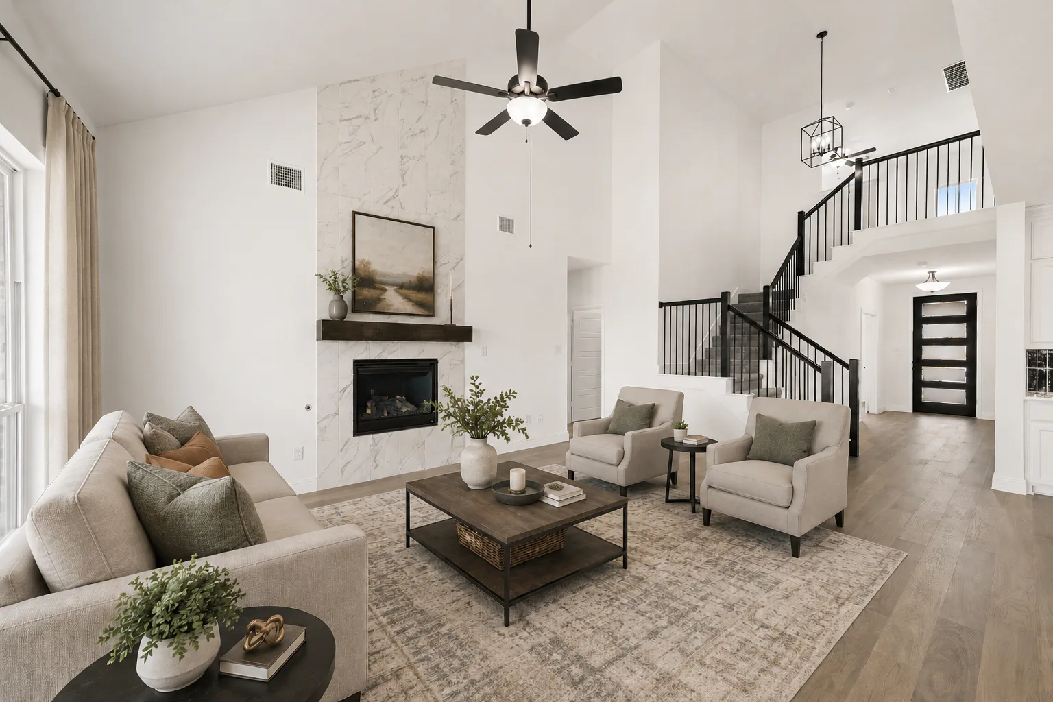 Virtually staged living room in a new traditional style home by Kindred Homes