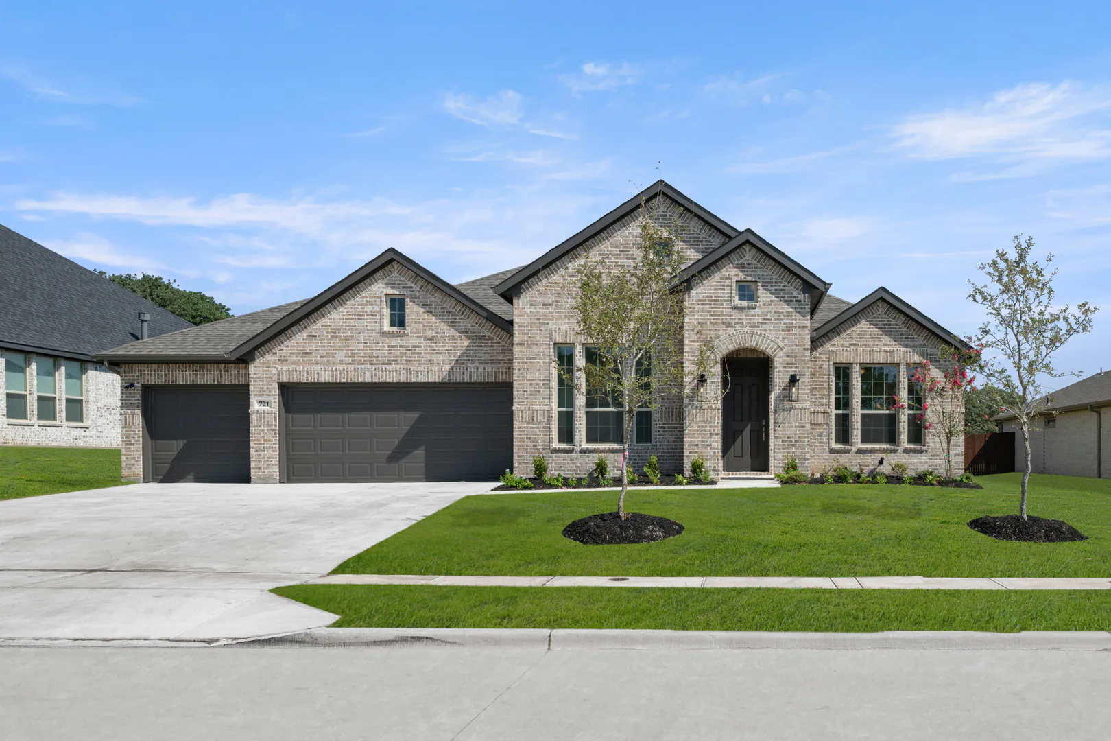 Exterior of a modern farmhouse transitional style home by Kindred Homes