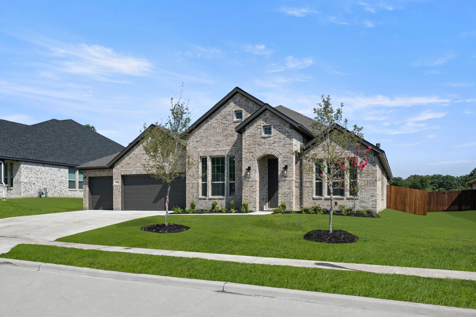 Exterior of a modern farmhouse transitional style home by Kindred Homes