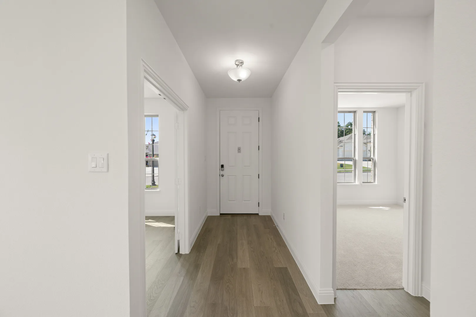 Entryway in a modern farmhouse transitional style home by Kindred Homes