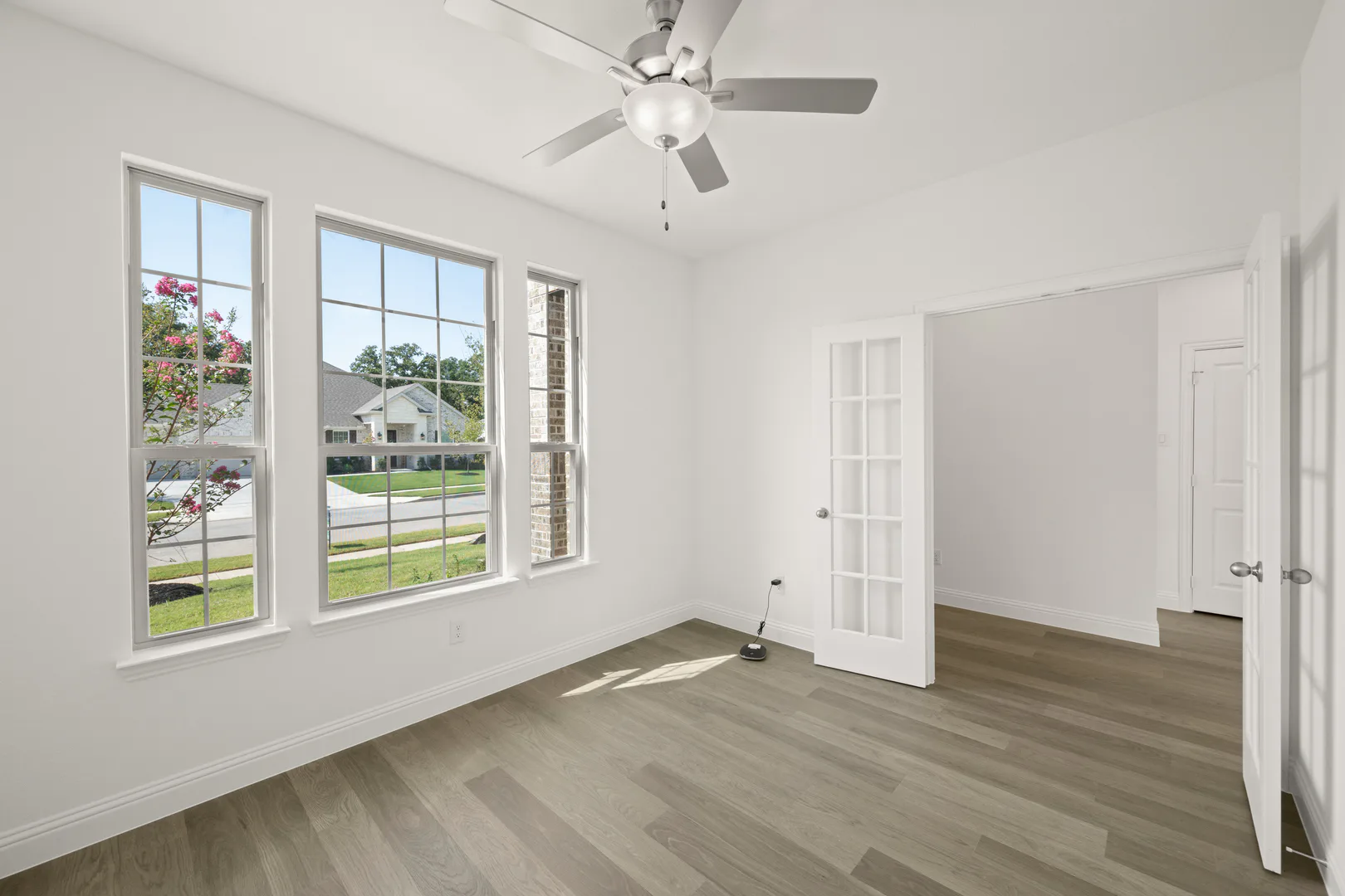 Study in a modern farmhouse transitional style home by Kindred Homes