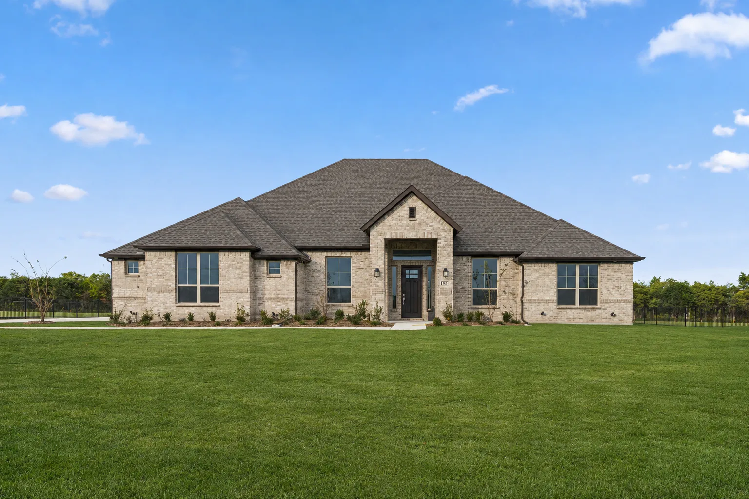 Exterior of a modern Texas ranch style home in DFW by Kindred Homes