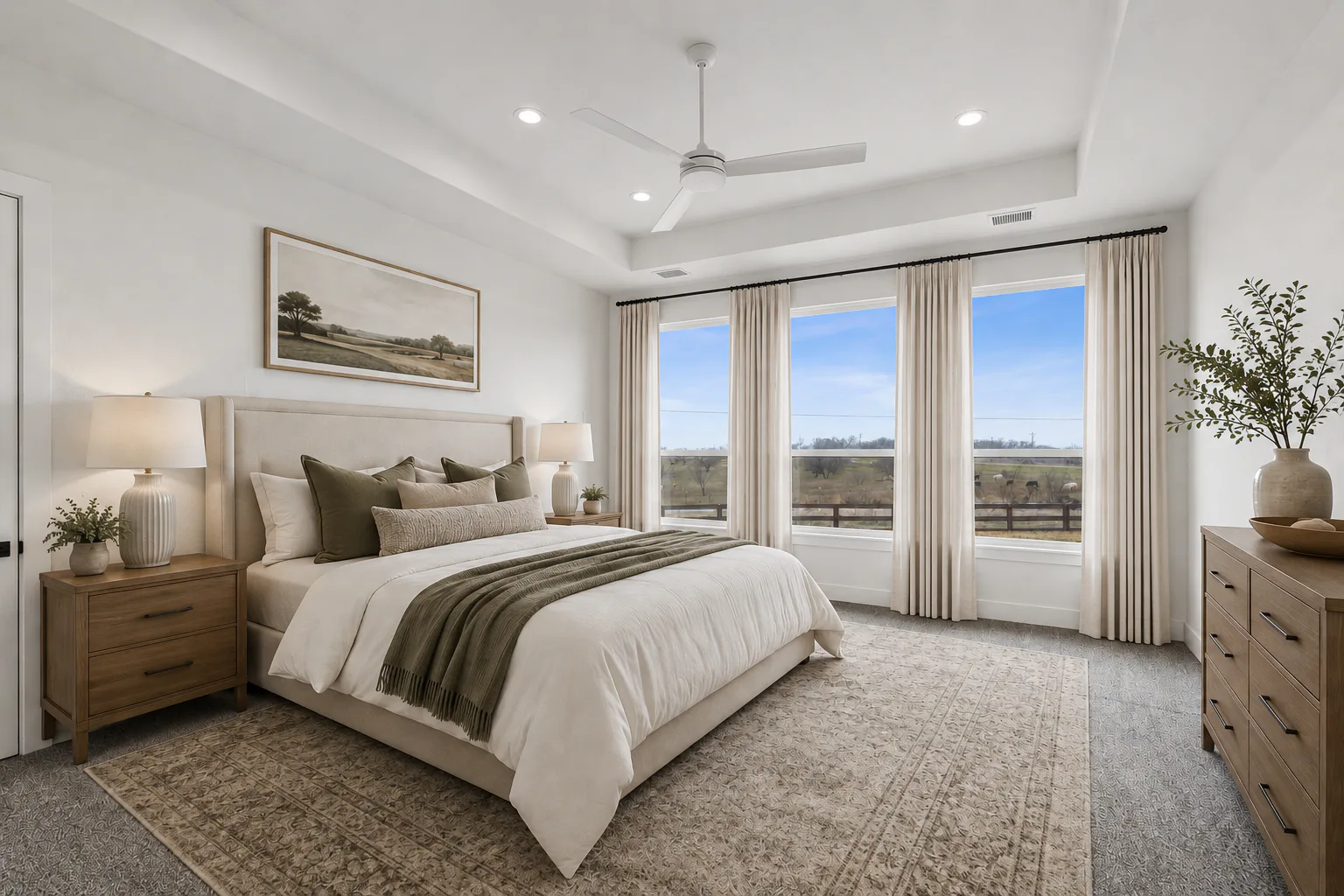 Virtually staged primary bedroom in custom home by Kindred Homes