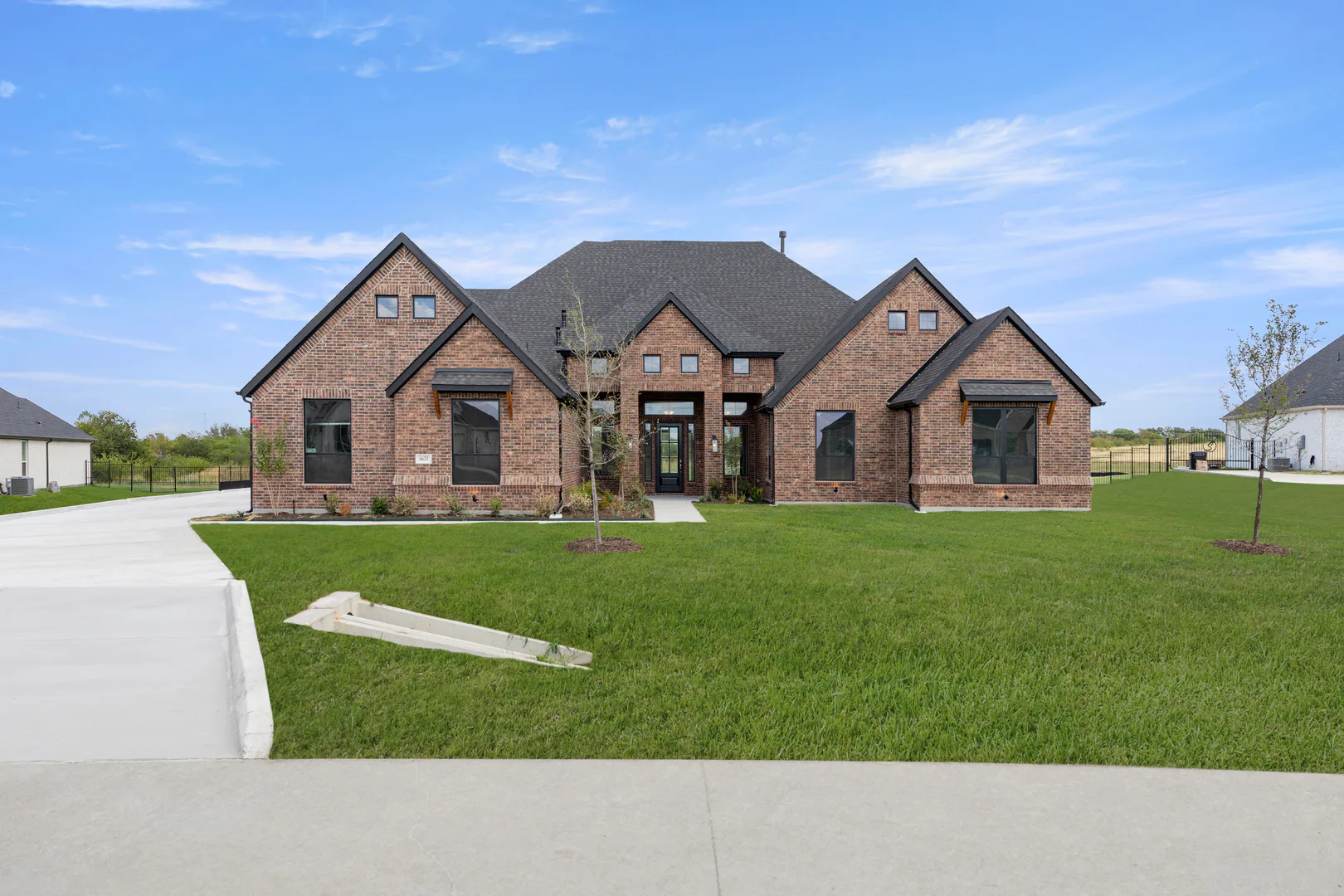 Front exterior of a transitional ranch style home by Kindred Homes