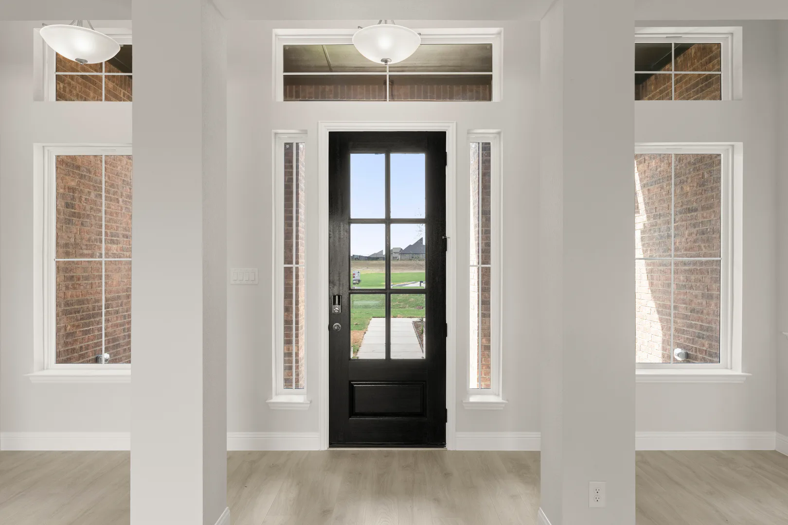 Entryway of a transitional ranch style home by Kindred Homes