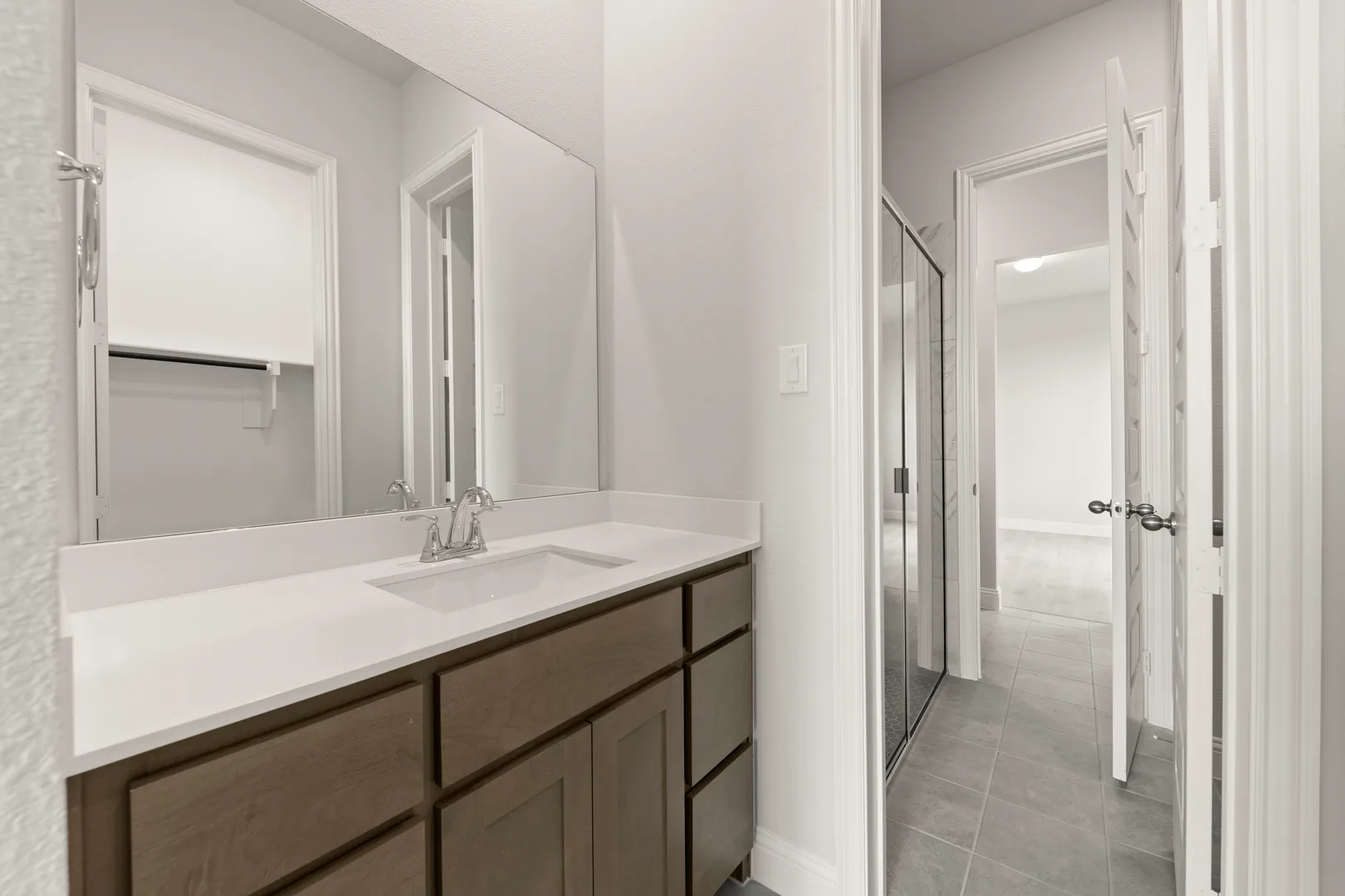 Secondary bathroom in a transitional ranch style home by Kindred Homes
