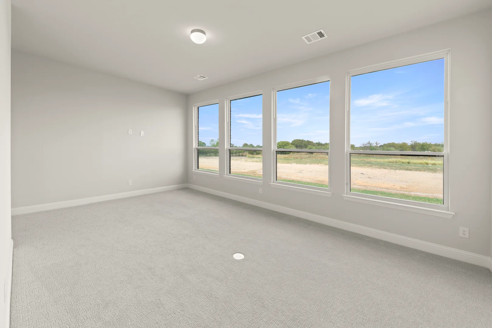 Game room in a transitional ranch style home by Kindred Homes