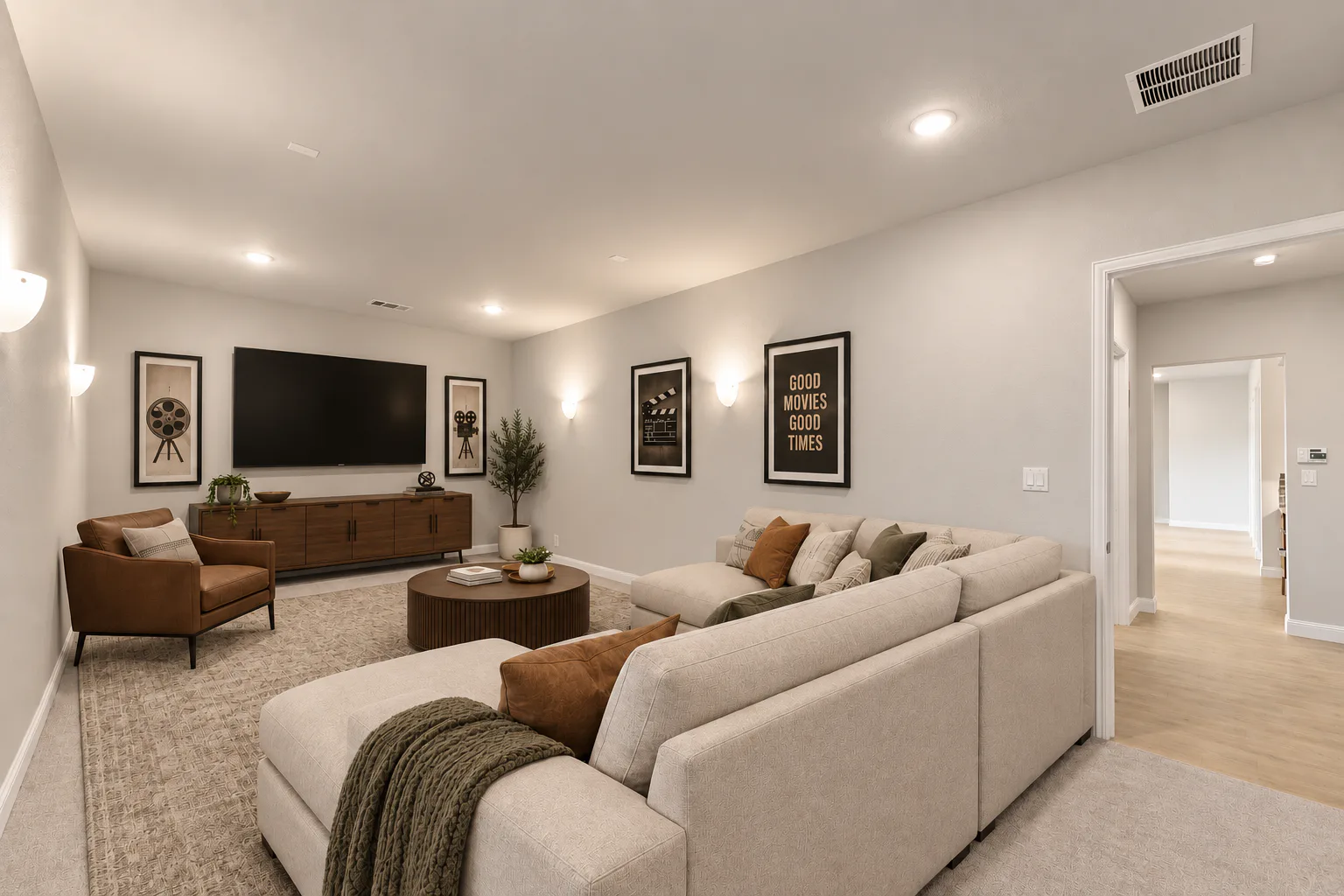 Virtually staged media room in a transitional ranch style home by Kindred Homes