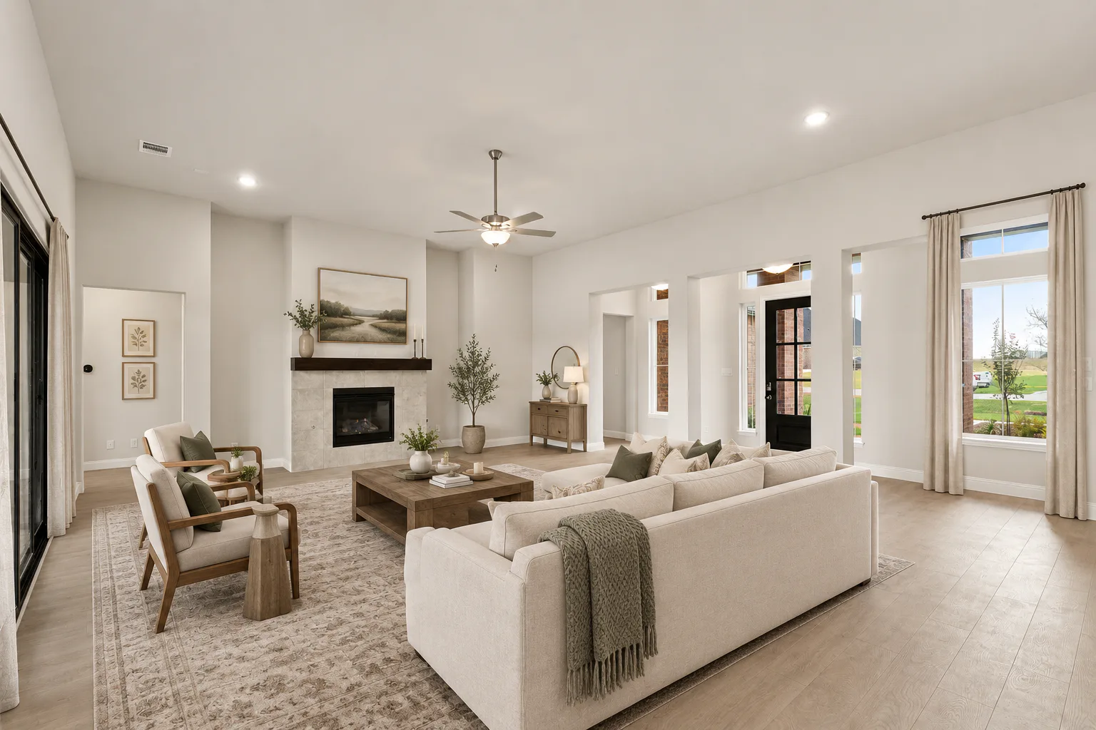Virtually staged living room in a transitional ranch style home by Kindred Homes
