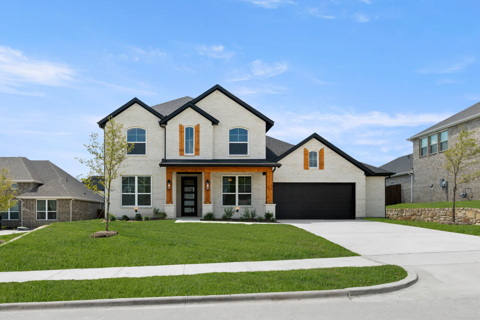 Exterior of a new traditional style home by Kindred Homes