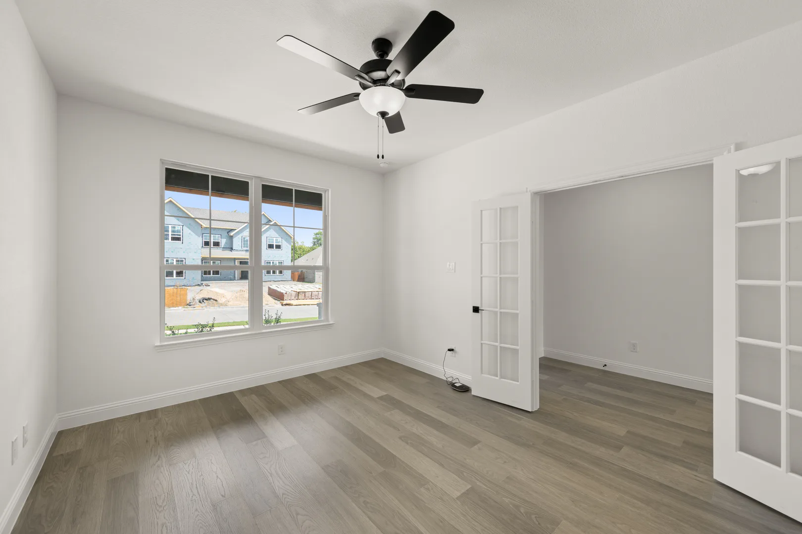 Study in a new traditional style home by Kindred Homes