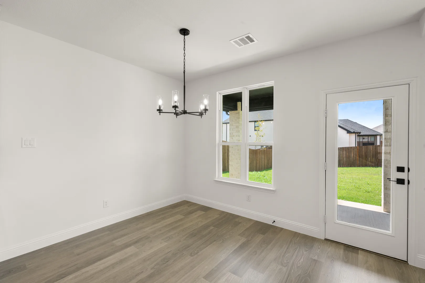 Breakfast nook in a new traditional style home by Kindred Homes