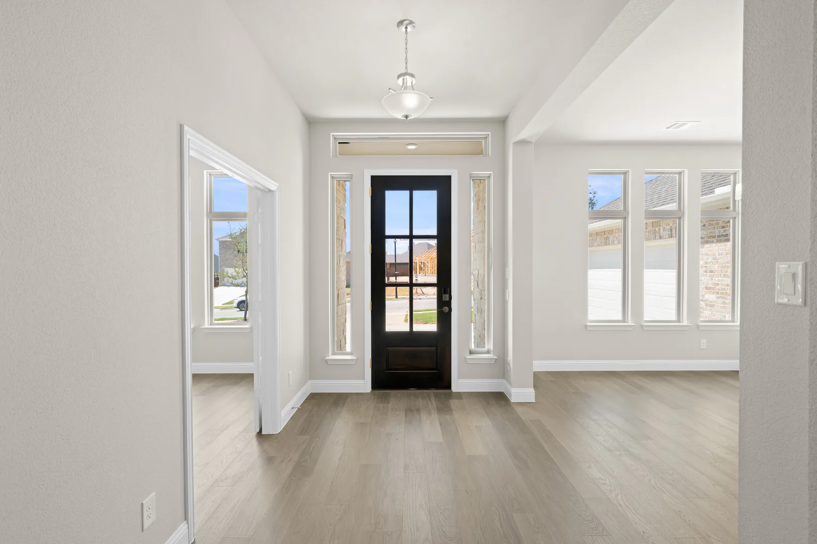 Entryway of a transitional ranch style home by Kindred Homes