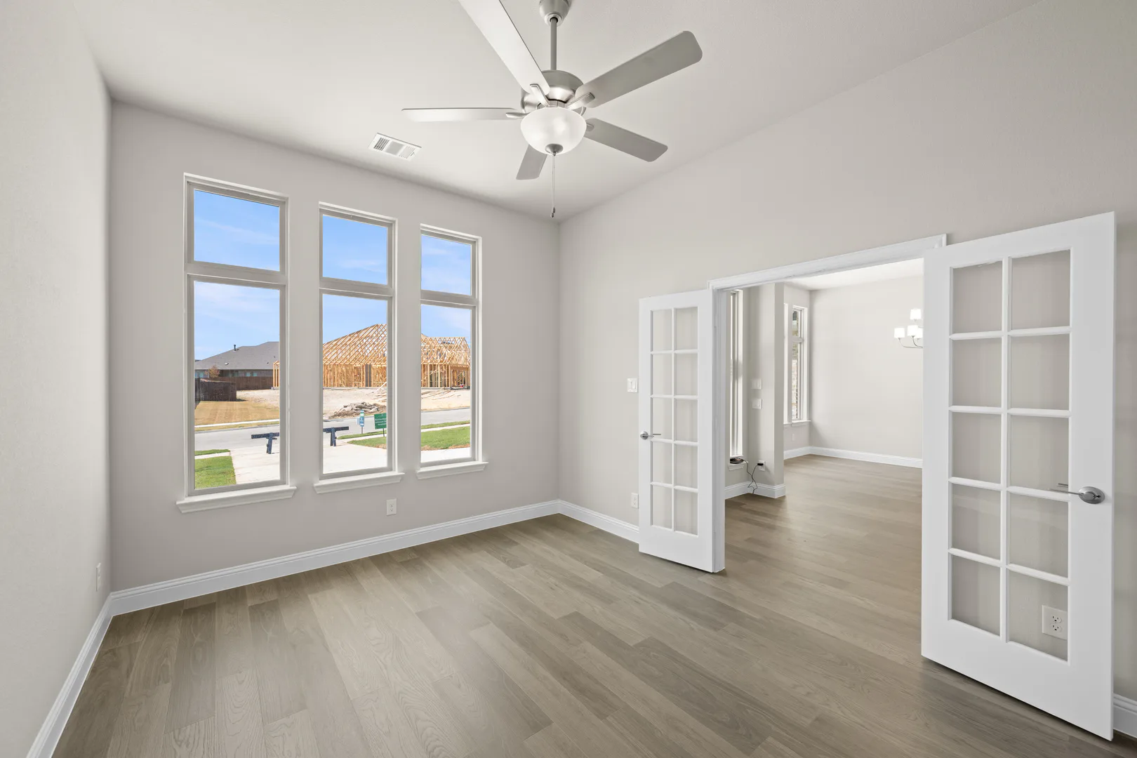 Study in a transitional ranch style home by Kindred Homes