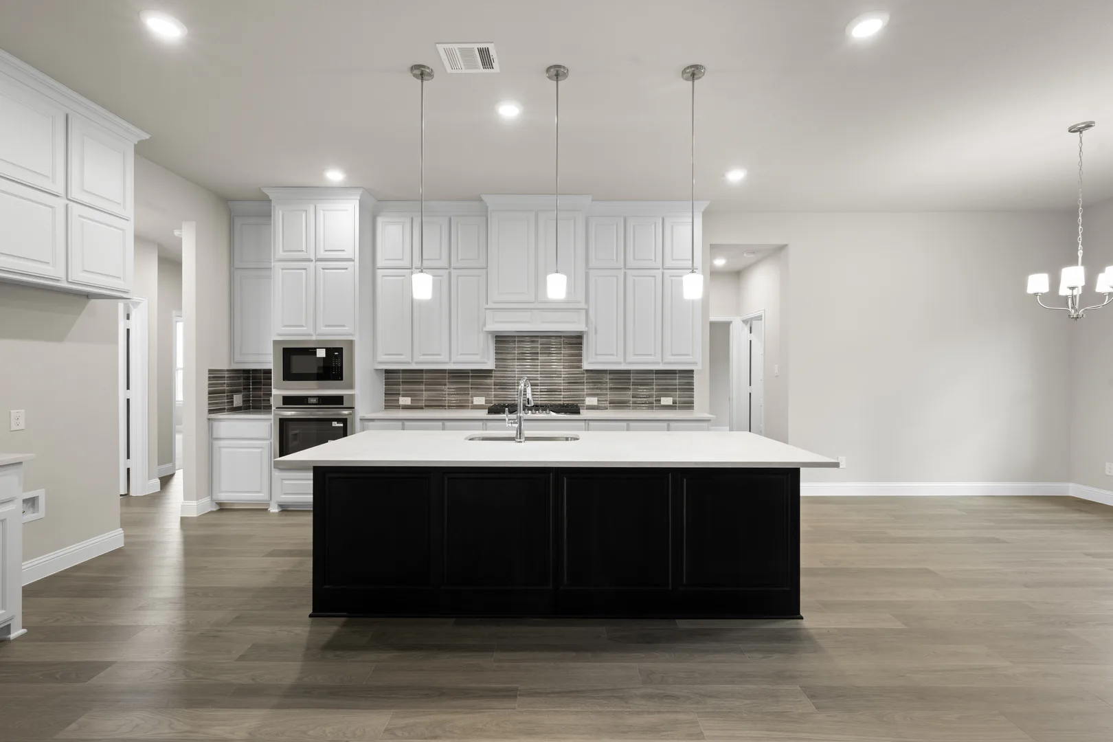 Kitchen in a transitional ranch style home by Kindred Homes