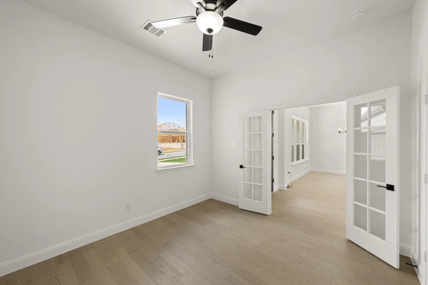 Study in a transitional ranch style home by Kindred Homes